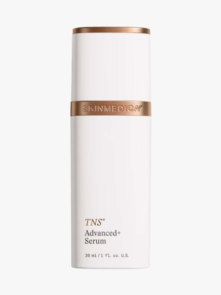 White bottle of SkinMedica TNS Advanced+ Serum with bronze and white cap on light gray background